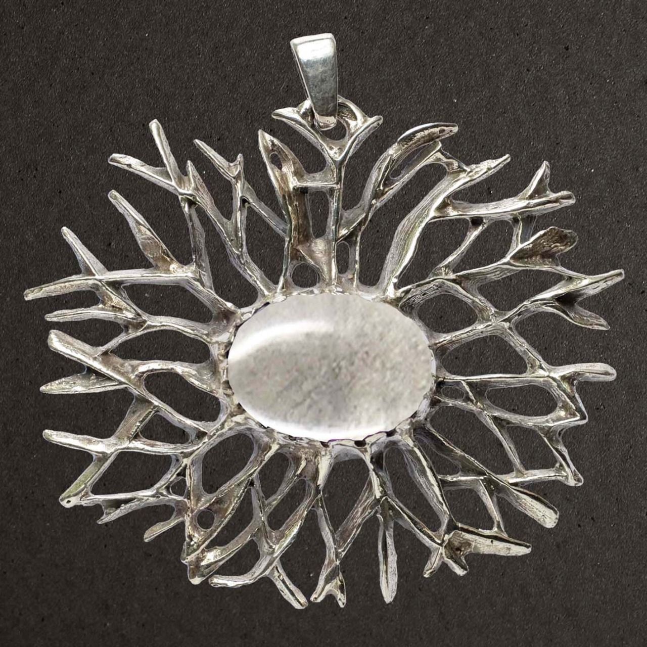 Pendentif argent massif 925/1000. Bijoux Toulhoat. Étoile avec cristal de roche.
