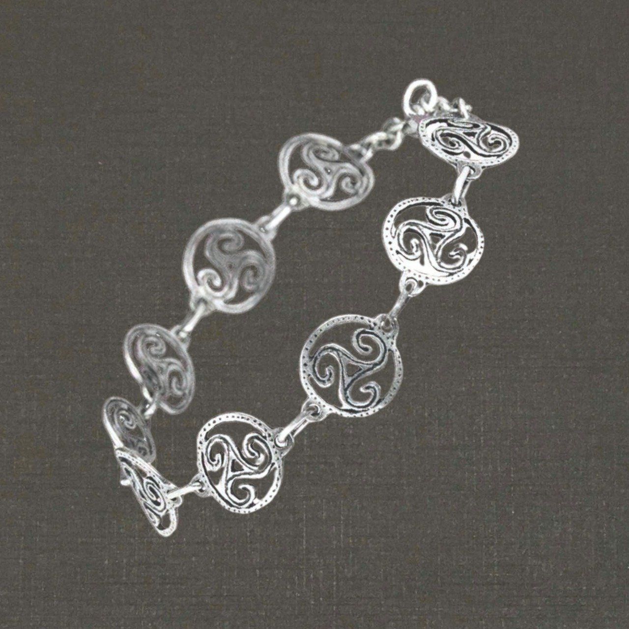 Bracelet articulé argent massif 925/1000 triskels cerclés, bijoux Pierre Toulhoat.